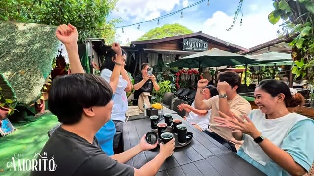 Happy guests celebrating at Casa Amorito outdoor dining area